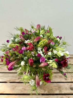 Fresh cut flowers. Hand-Tied Seasonal Bouquet - 100% British in April. Bouquet features Brodiaea, Dubium, Sweet William, Nigella, Alstroemeria, Scented Pinks. Vase not included.