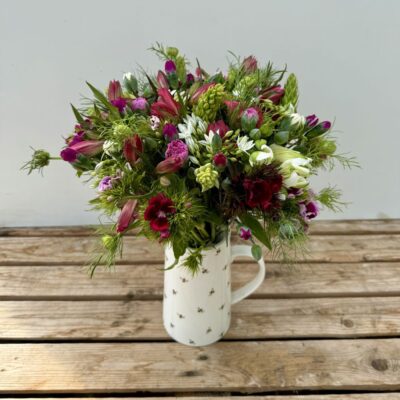 Fresh cut flowers. Hand-Tied Seasonal Bouquet - 100% British in April. Bouquet features Brodiaea, Dubium, Sweet William, Nigella, Alstroemeria, Scented Pinks. Vase not included.