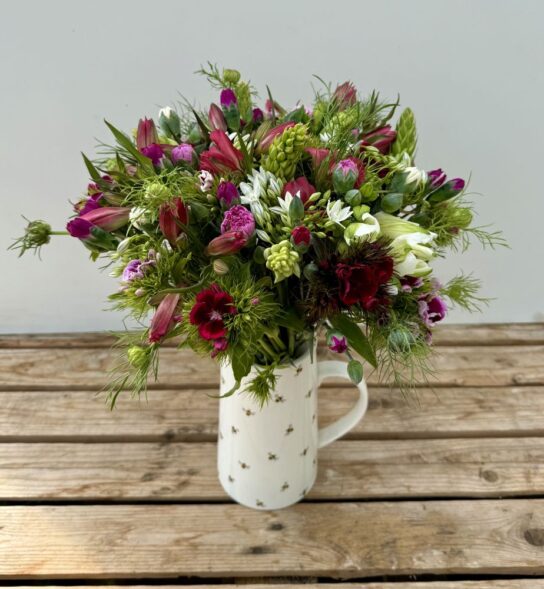 Fresh cut flowers. Hand-Tied Seasonal Bouquet - 100% British in April. Bouquet features Brodiaea, Dubium, Sweet William, Nigella, Alstroemeria, Scented Pinks. Vase not included.