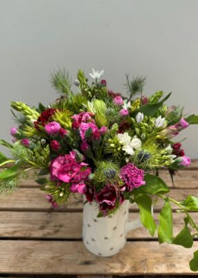 A Hand-Tied 100% British Posy from Mid May. Posy includes Sweet William, Alstroemeria, Scented Pinks, Dubiums, Nigella and Solomon Seal.