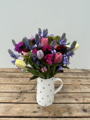 A bunch of blue Cornish Scillas, Sweet William in shades of pink, white and purple and mixed colour Tulips.