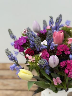 A bunch of blue Cornish Scillas, Sweet William in shades of pink, white and purple and mixed colour Tulips.